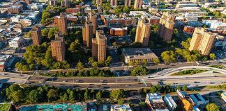 Aerial view of city high-rise apartments and highway
