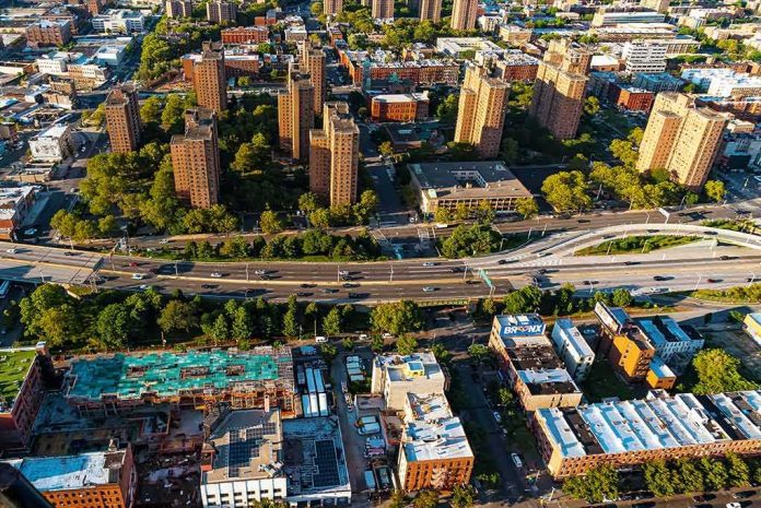 Aerial view of city high-rise apartments and highway