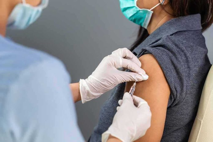 Healthcare worker administers vaccine to patient’s upper arm