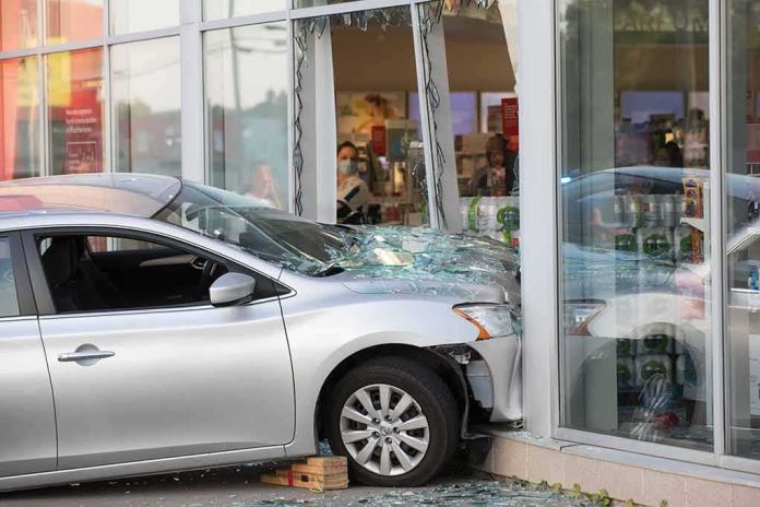 Silver car crashed into storefront window