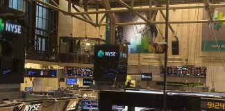 Wall Street is WARNS: The Crash of 2027 is Coming NYSE trading floor with monitors and tickers
