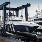 China’s ‘SuperYacht’ Takeover Sparks Fears of Spying at Sea Superyacht being lifted by a travel lift at a marina