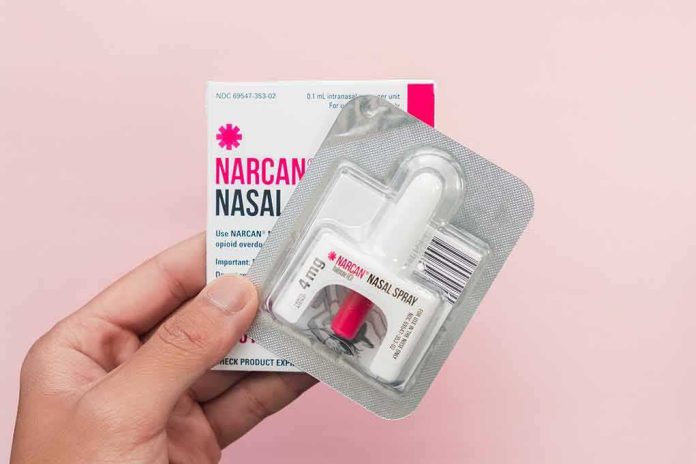 shutterstock_1962977485 Narcan nasal spray in blister pack held by hand