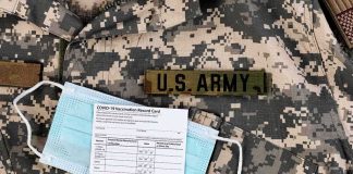 U.S. Army uniform with face mask and vaccination card