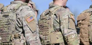 Terror Arrests Rock Base Used by U.S. Forces U.S. soldiers in camouflage uniforms with tactical vests