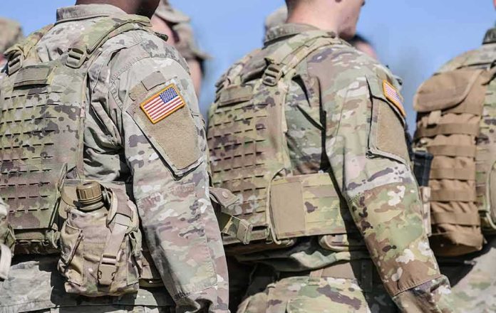 shutterstock_2145891607 U.S. soldiers in camouflage uniforms with tactical vests