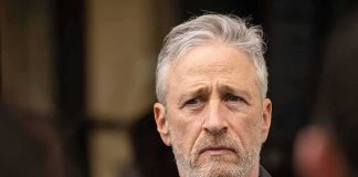 Jon Stewart Demands Constitution Be Changed By FORCE older man with gray hair and beard looking serious