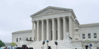 U.S. Supreme Court building with media equipment set up outside