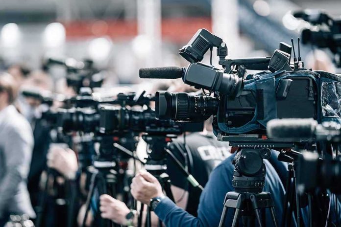 shutterstock_2197858977-4 Broadcast cameras on tripods at a press event