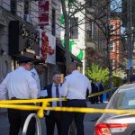 ‘God Bless You’: Mayor Smiles After $1.5M Fraud Arrest police officers and investigator at a taped-off city sidewalk