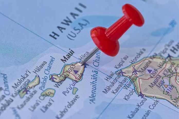 shutterstock_2346172443 Red pushpin marking Maui on a map of Hawaii