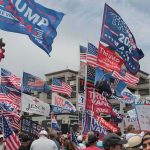 Senate Nominee Calls Drag Shows ‘Wholesome for Kids’ Crowd at political rally with many American and campaign flags