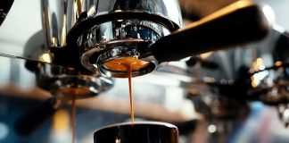 espresso machine pouring coffee into a cup
