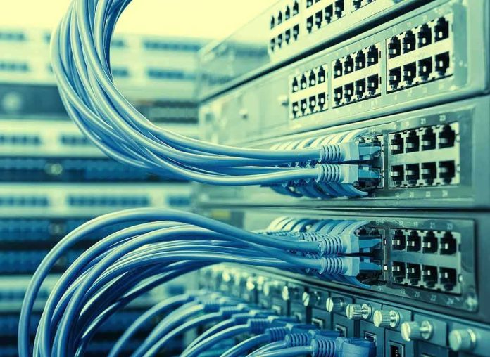 shutterstock_341537273 Network switches with blue Ethernet cables