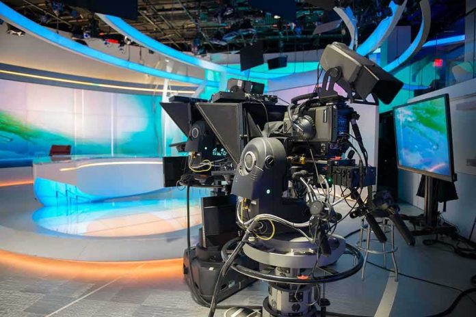 robotic television cameras on a modern news studio set