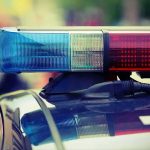 Flock Safety Cameras Face Growing Calls for Constitutional Guardrails Police car light bar with red and blue sirens