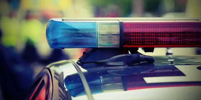 shutterstock_501438715 Police car light bar with red and blue sirens