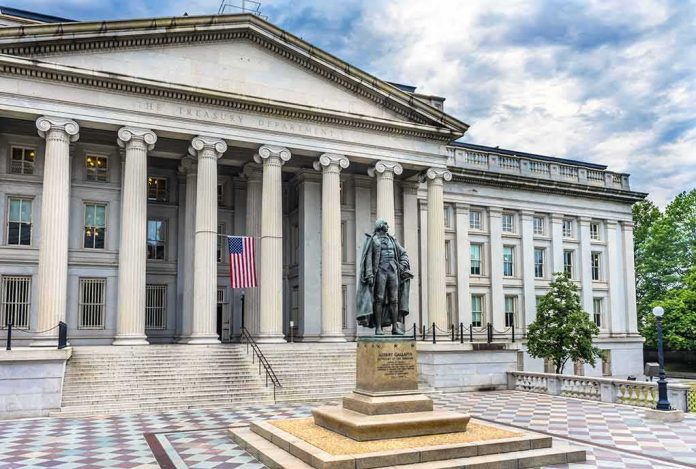 Neoclassical government building with columns and a central bronze statue