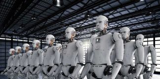 Rows of humanoid robots standing in a warehouse
