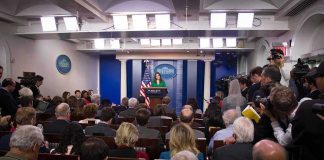 Jim Acosta on Trump’s White House Media Ban Press secretary at podium addressing reporters in briefing room