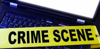 2 Ole Miss Students Found Dead in Separate Incidents Laptop keyboard with yellow crime scene tape across it