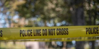 Businessman PISTOL-WHIPPED in Broad Daylight yellow police tape cordoning off an outdoor area
