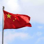 Chinese national flag waving on a flagpole