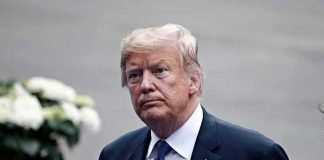Trump KNEW Energy Prices Could Jump man in a suit with an American flag pin