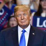 Trump Wants Zelensky OUT Donald Trump at a rally wearing a dark suit and blue tie