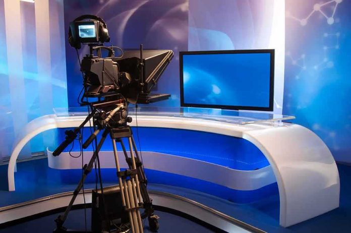 shutterstock_115378765 Television studio with camera and news desk