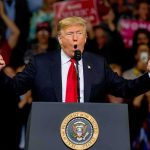 Trump’s Iran Remark Sets Off California FURY Donald Trump speaking at a rally podium with arms raised