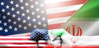 US and Iran flag fists bumping against split flags