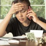 Medicare Checks Hide a BILLION Dollar Question Person on phone reviewing bills at a table