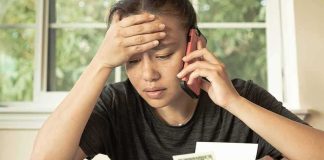 Medicare Checks Hide a BILLION Dollar Question Person on phone reviewing bills at a table
