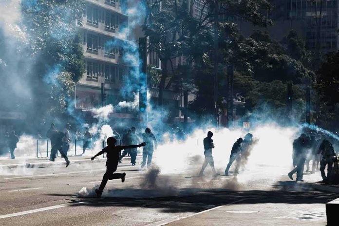 Protesters running through tear gas on a city street