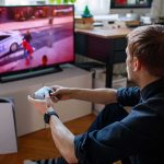 1.5M Americans May Skip Work for THIS man playing video game on a TV with a controller