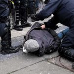 Teen Arrested After HORRIFIC France Attack police detain person on sidewalk during street incident