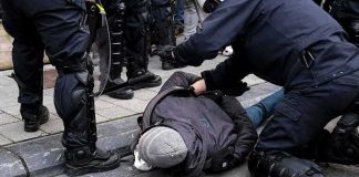 Teen Arrested After HORRIFIC France Attack police detain person on sidewalk during street incident