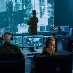 Your Home Camera Could Be HACKED for War Military analysts monitor data on multiple screens in a command center