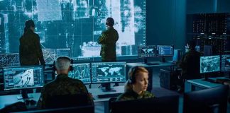Your Home Camera Could Be HACKED for War Military analysts monitor data on multiple screens in a command center