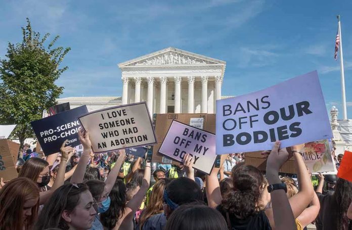 Protesters with signs in front of a neoclassical courthouse