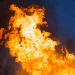 Tourist Office Goes Up in FLAMES Large flames against a dark blue sky