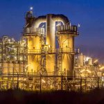 Blasts Knock Out Venezuela’s No. 2 REFINERY An industrial facility with illuminated structures at night