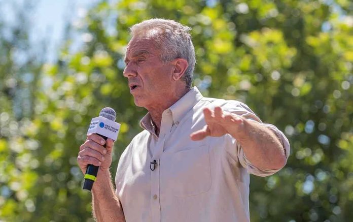 shutterstock_2346739531 Robert F. Kennedy Jr. speaking outdoors with a microphone