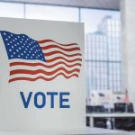 Texas Senate Candidate Lands a Surprise ENDORSEMENT Voting booth with American flag design in a modern polling place