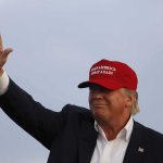 Trump Rally Heckler EJECTED After Outburst Donald Trump waving in a red cap