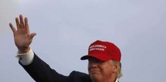 Trump Rally Heckler EJECTED After Outburst Donald Trump waving in a red cap