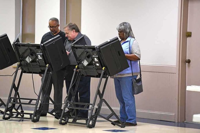Lester Bowie and Miriam Tlali using electronic voting machines at a polling place