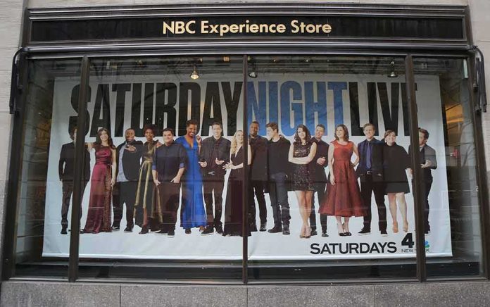 shutterstock_756676555-2 Storefront window with large SNL poster featuring Leslie Jones, Bobby Moynihan, Michael Che, Shirley Ellis, Kenan Thompson, and Richard Z. Kruspe