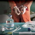 Two Lethal Doses and She SURVIVED Medical vials and IV lines on a table with a handcuffed person in the background